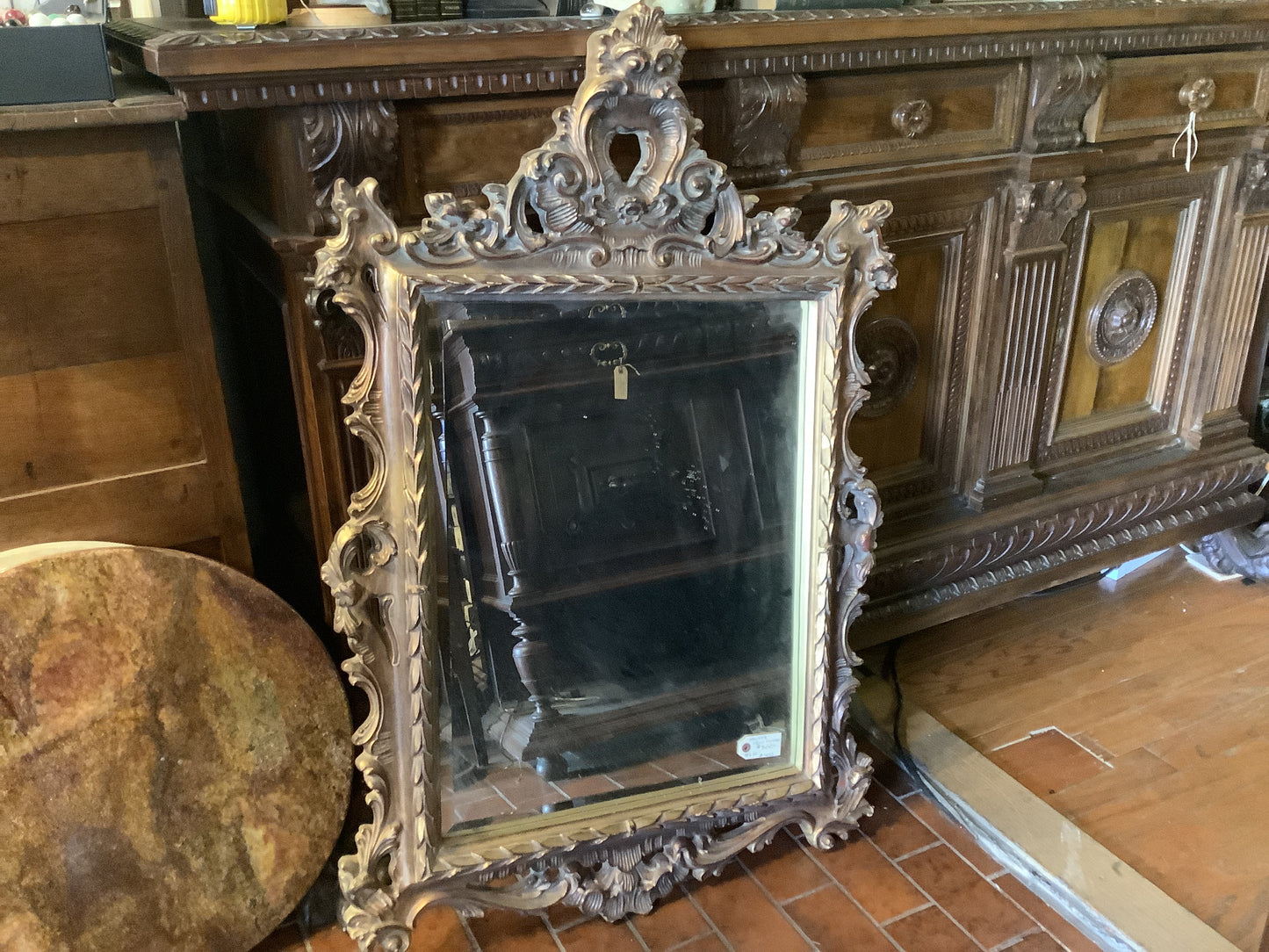 4025. Ornate gold mirror