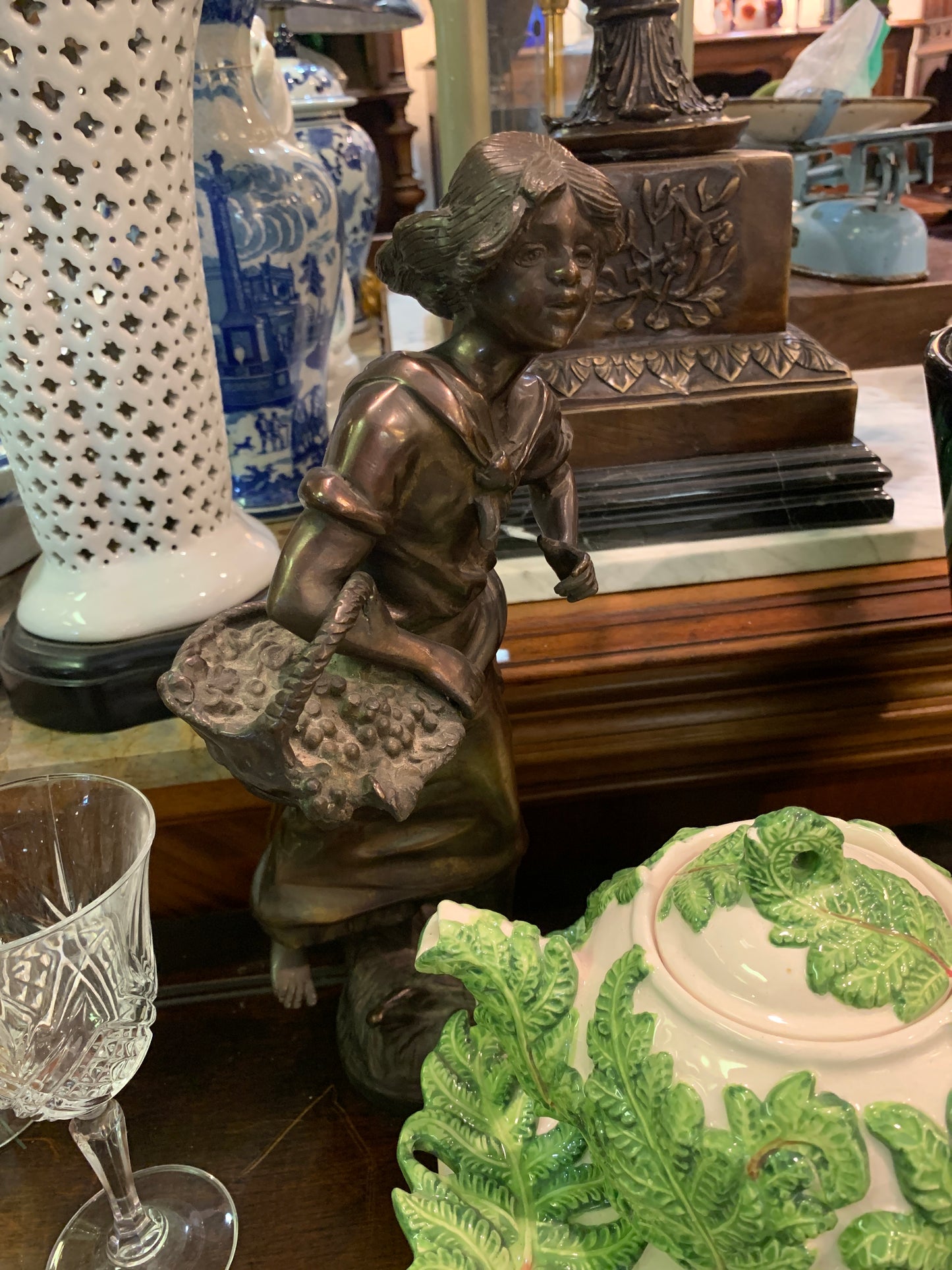 827. Bronze girl/basket