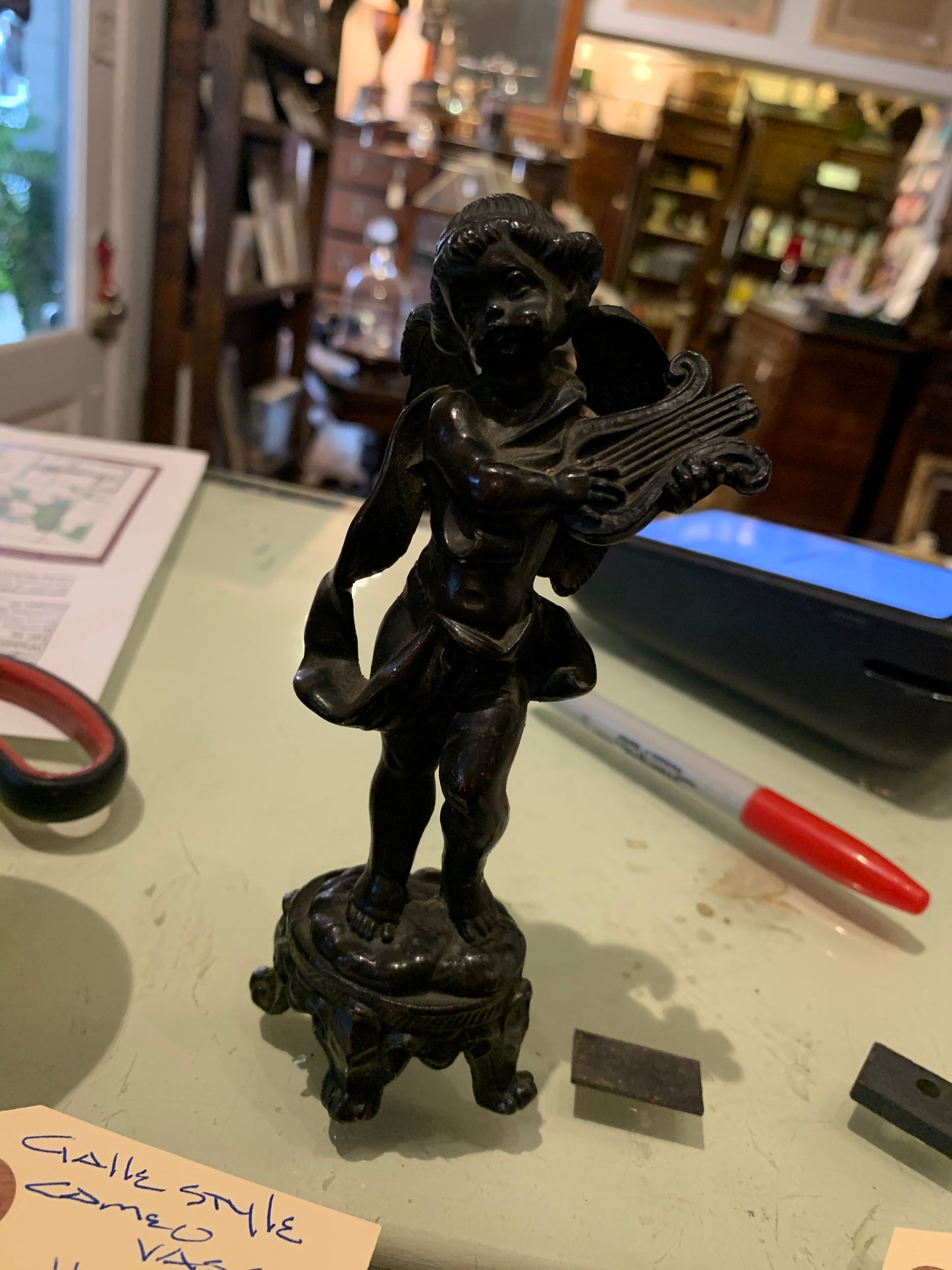 56. Bronze cherub w/ lyre