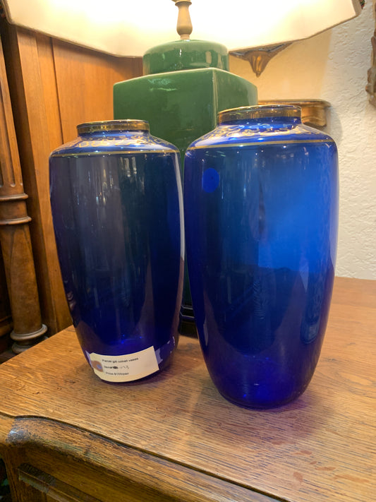1173. Parcel gilt cobal vases