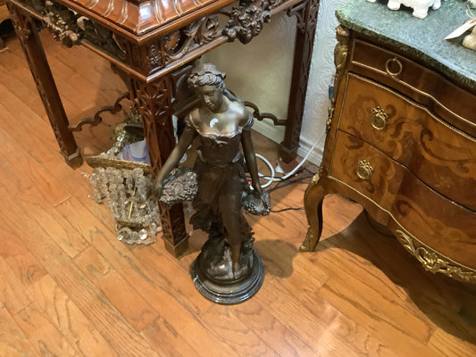 1165. Bronze woman with basket 29” statue