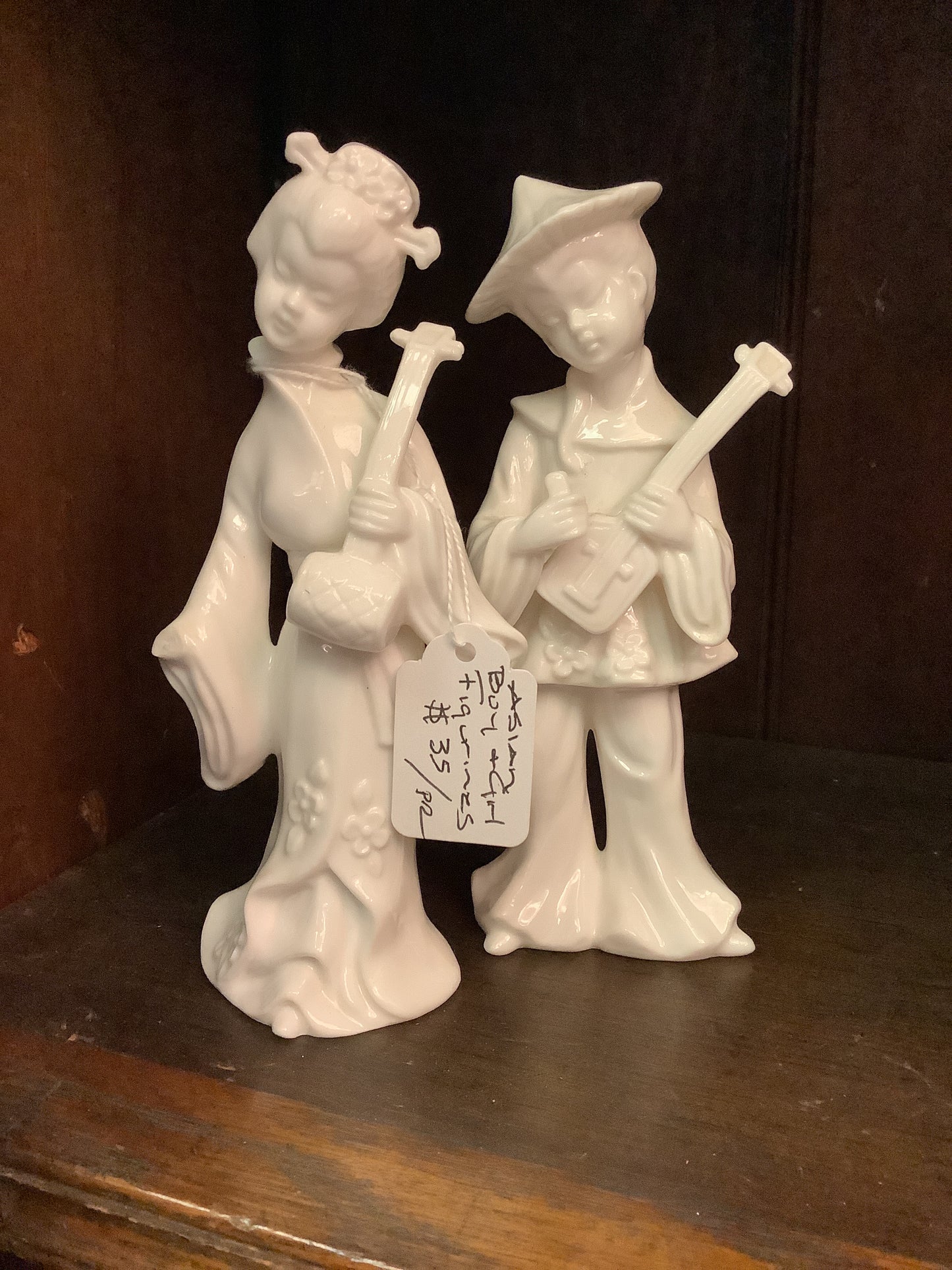 206. Asian boy girl figurines