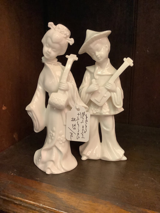 206. Asian boy girl figurines