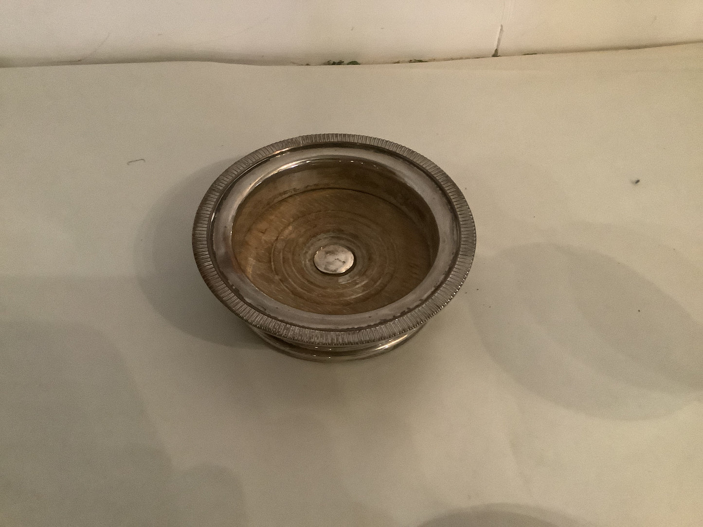 384. Silverplate bottle coaster
