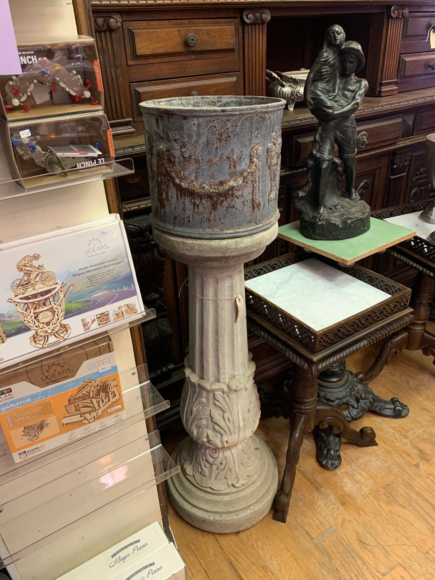 17. Concrete column w/ iron planter
