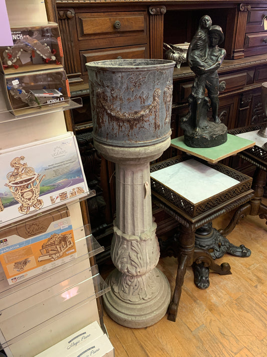 17. Concrete column w/ iron planter