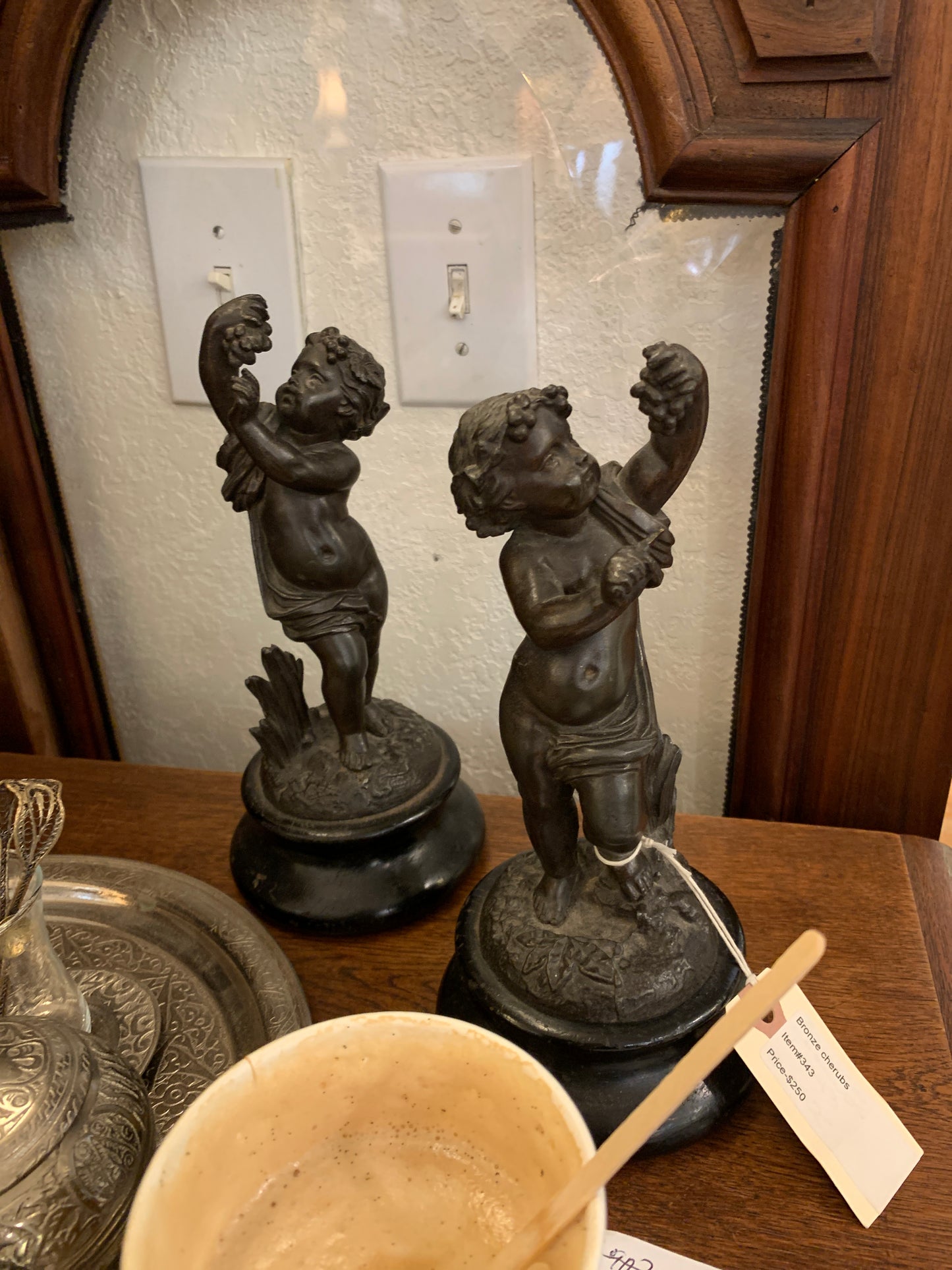 343. Small bronze cherub statues