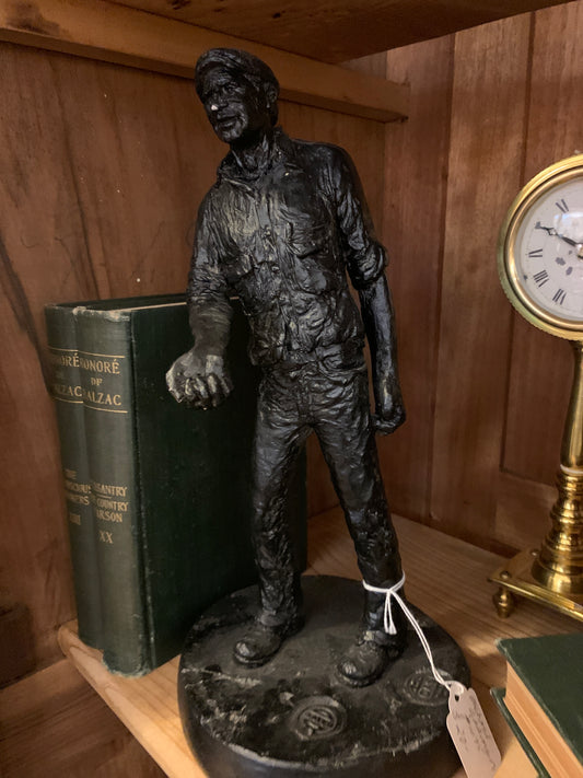 1075. Michael Garman Newsman statue