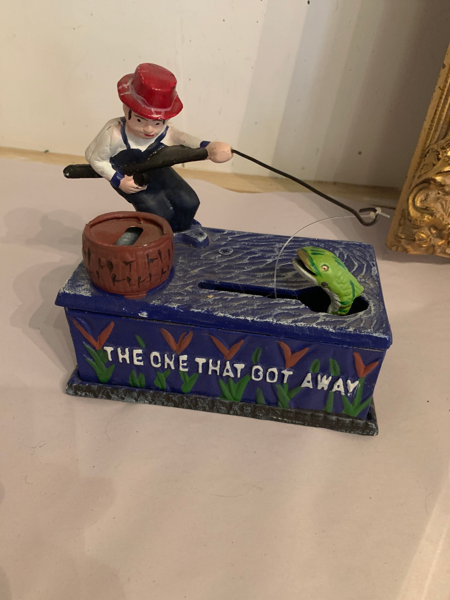 48. Fisherman cast iron bank